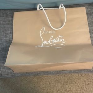 Authentic Christian Louboutin bag with red ribbon